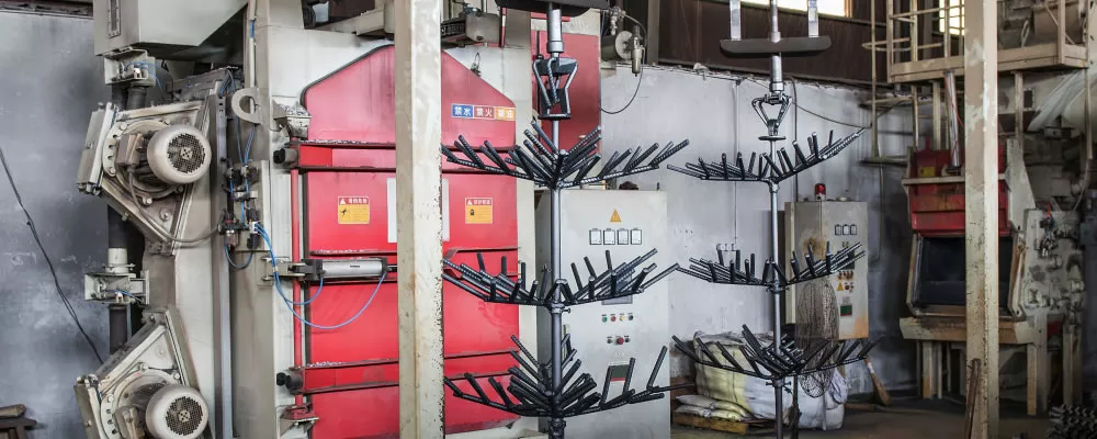 A casting machine for pouring the molten metal into the ceramic shells