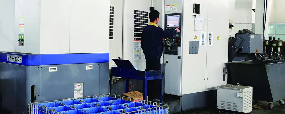 SAIVS factory workers operate equipment